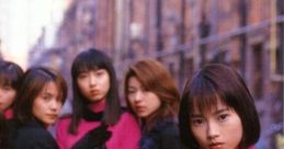 Morning Musume members in stylish outfits promoting "Memory Seishun no Hikari" with vibrant colors and an urban backdrop.