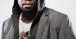 50 Cent in a stylish outfit, featuring a hoodie and unique graphic T-shirt, showcasing his signature urban fashion.