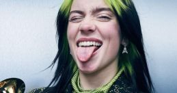 Billie Eilish playfully shows her fun side, surrounded by multiple Grammy Awards, showcasing her musical accomplishments.