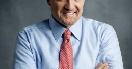 Jim Cramer smiling confidently in a dress shirt and tie, showcasing his expertise in financial markets and investment advice.