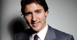 Justin Trudeau wearing a tailored suit and tie, smiling confidently against a neutral background.