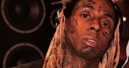 Lil Wayne showcasing his signature style with elaborate jewelry and unique tattoos in a recording studio setting.