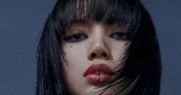 Lisa flaunts an edgy look with sleek black hair, bold makeup, and layered silver chains, exuding confidence and style.