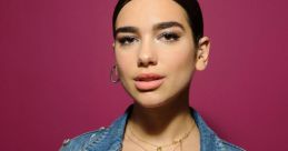 Dua Lipa showcases her chic style in a embellished denim jacket against a vibrant pink backdrop. Perfect for fashion enthusiasts.