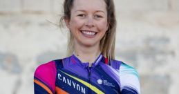 Ella Harris smiles confidently in a colorful Canyon cycling kit, showcasing her passion for women's cycling and sports.