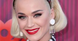 Katy Perry showcases her iconic style with bold makeup and chic attire at a vibrant event.