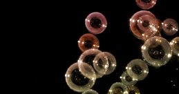 Colorful soap bubbles floating against a black background, showcasing reflections and intricate details of "burbujas.