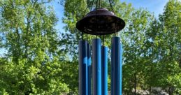 Wind-Chimes The melodic tones of wind chimes gently drift through the air, creating a soothing ambient backdrop. The of