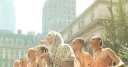 Groups of people in traditional attire joyfully chanting and playing drums outdoors in an urban setting.