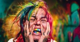 Colorful-haired individual expressing emotion in vibrant urban setting, showcasing unique style and trap culture influences.