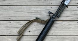 M16A2 The distinct of an M16A2 firing three single rounds rings out in the field, echoing through the vast expanse. The