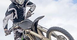 Motocross The revving engine of a motorcycle echoes through the air as a dirt bike approaches the starting line at the