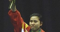 Gold medalist proudly celebrates victory, holding sunflowers in a vibrant red and yellow champion’s outfit.