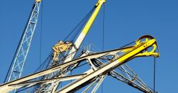 Cranes at port lifting equipment against a clear blue sky, showcasing industrial machinery and maritime logistics.