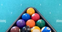 Triangle rack filled with colorful billiard balls, ready for a game on a green felt pool table.