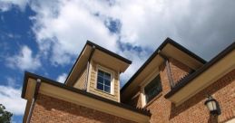 Elegant wooden garage doors complement brick exterior and upscale architecture, enhancing curb appeal and home aesthetics.