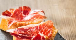 Iberico The of a sharp knife slicing through the tough exterior of a jamón ibérico is a symphony of precision and skill.