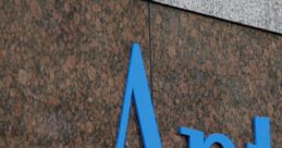 Blue "Anthem" signage on a textured stone wall, representing the Ohio Anthem company, showcasing modern branding.