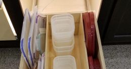 Tupperware Library In the Tupperware's Library, the distinctive of containers being opened and closed fill the air. The