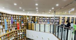 Modern Metropolitan Library interior featuring shelves of books, cozy reading spaces, and an inviting staircase.