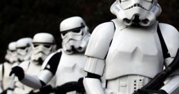 Stormtroopers in white armor marching in formation, holding rifles from the iconic Star Wars franchise.