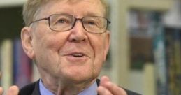 Alan Bennett animatedly discussing literature, showcasing his engaging personality and passion for storytelling.