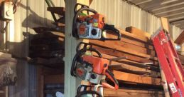 Four chainsaws neatly organized on a wooden post in a well-stocked workshop library for woodwork enthusiasts.