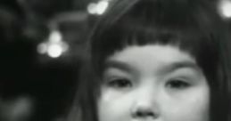 Young Björk talking, showcasing her early charisma and talent in a nostalgic black-and-white setting.