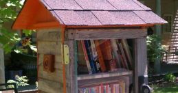 Little Free Library on a tree, filled with colorful books, promoting community reading at Edge Of Town Library.