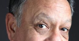 Cheech Marin posing for a portrait, showcasing his signature smile and expressive eyes, reflecting his comedic style.