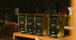 Perfume Library The rich, metallic clink of a cologne bottle being set down on a cool granite countertop reverberates