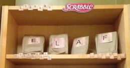 Scrabble Library The of Scrabble game tiles moving across a wooden surface is a unique and satisfying . The smooth, sliding