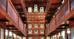 Historic Cranes Library interior featuring wooden architecture, stained glass, and a large communal table for reading.