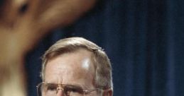 George H. W. Bush delivering a speech, emphasizing key points with a raised finger, set against a deep blue backdrop.