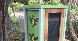 Beehive exterior Library The of bees buzzing in front of the landing zone outside the beehive is a symphony of nature's