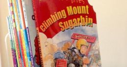 Acrylic book holder displaying "Climbing Mount Sugarbin" and other titles, ideal for organizing kids' books at Holder Library.