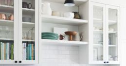 Above Sink Library The first heard is the gentle creaking of a wooden and plexiglas apartment kitchen cupboard above the