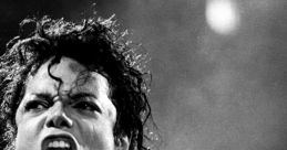 Michael Jackson passionately singing on stage, showcasing his iconic style and powerful stage presence.