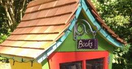 Colorful little library box filled with books, promoting community reading and access to literature in a serene outdoor setting.