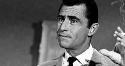 Rod Serling gesturing thoughtfully, embodying his iconic presence as the creator of "The Twilight Zone" in a classic scene.