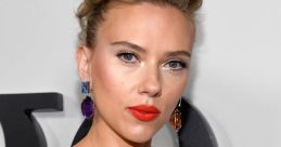 Scarlett Johansson exudes elegance in a sparkling strapless gown, showcasing bold red lips and statement earrings.