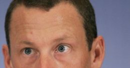 Lance Armstrong speaks at a press conference, addressing doping allegations and his cycling career challenges.