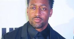 Jaleel White attending an event, showcasing his iconic role as Sonic the Hedgehog, dressed in a sleek black attire.