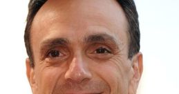 Hank Azaria smiling at a public event, known for voicing Superintendent Chalmers in "The Simpsons.