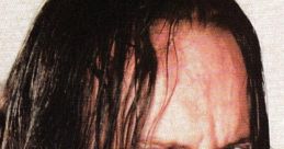 The Undertaker, iconic WWE wrestler Mark Calaway, showcases his intense expression and signature long hair.