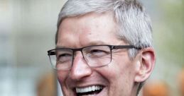 Tim Cook smiling while wearing glasses, embodying leadership and innovation in the tech industry.