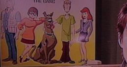 Velma, voiced by B.J. Ward, featured with the Scooby-Doo gang in a colorful animation scene. Classic cartoon nostalgia.