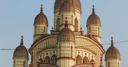 Temple The resonant clang of the massive temple bell reverberates through the air, filling the sacred space with its deep,