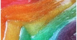 Colorful, glossy rainbow slime in vibrant hues of red, orange, yellow, green, blue, and purple, showcasing a smooth texture.