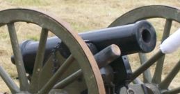 Historic cannon on wooden wheels, showcased in a grassy field, representing artillery's role in military history.